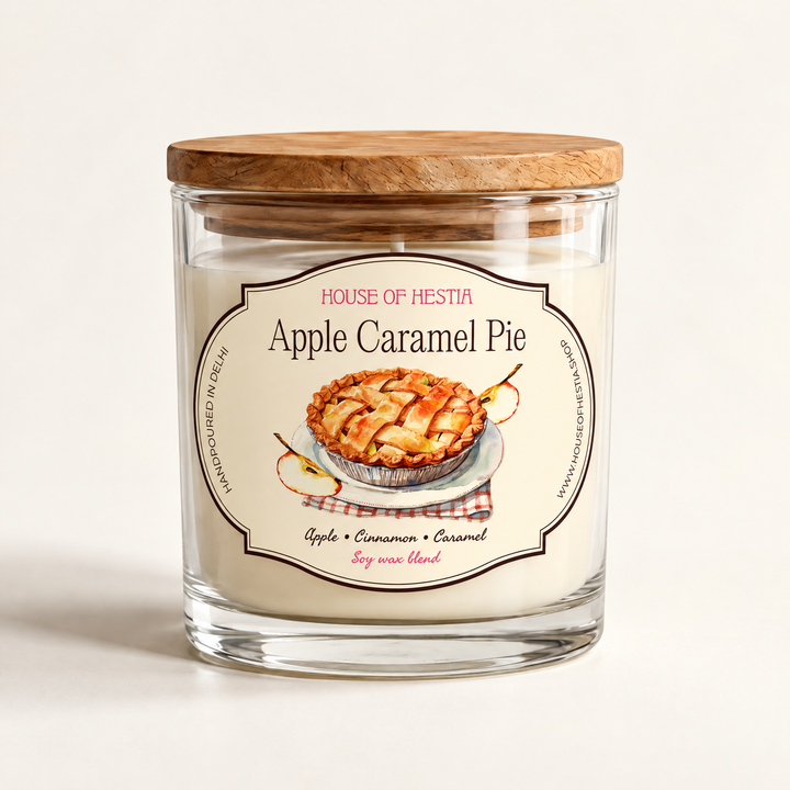 Apple Caramel Pie scented soy candle by House of Hestia in a clear glass jar with wooden lid